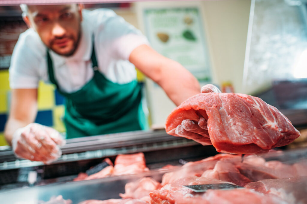 Shop Assistant In Apron Assorting Fresh Raw Meat I 2024 11 17 22 40 31 Utc 1