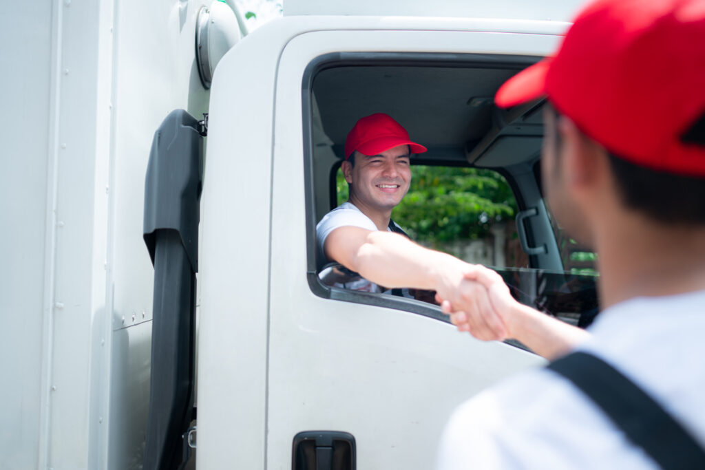 Delivery Man In Red Cap And Uniform Handshaking Ea 2025 01 08 19 11 43 Utc 1