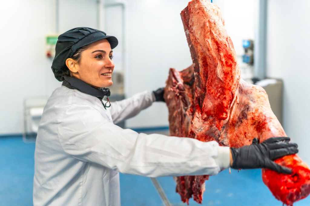 Female Butcher Carrying The Hanging Cut Pieces Of 2024 12 10 03 24 06 Utc 1